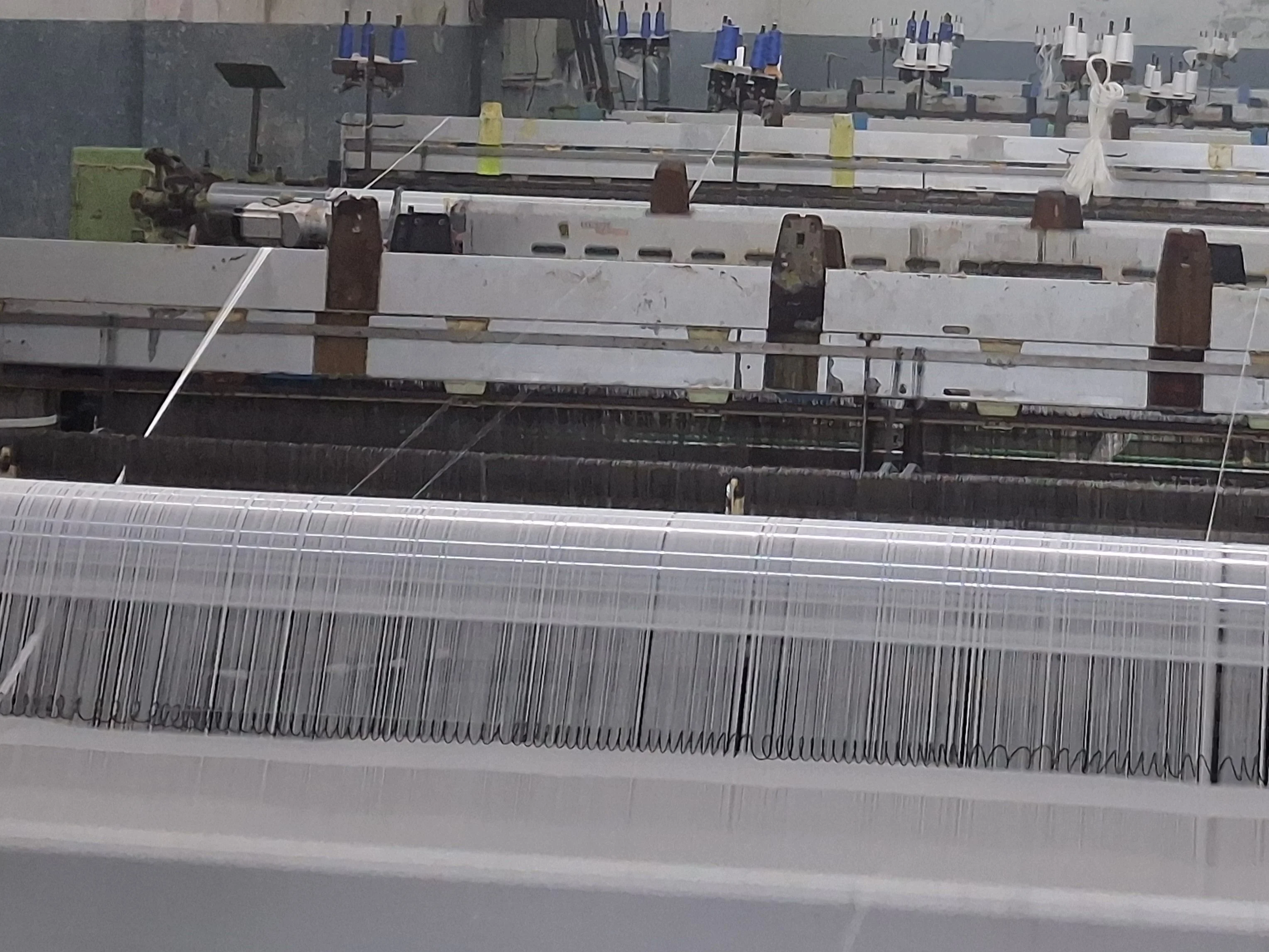 Shuttle-less Swiss looms at Makki Weavers